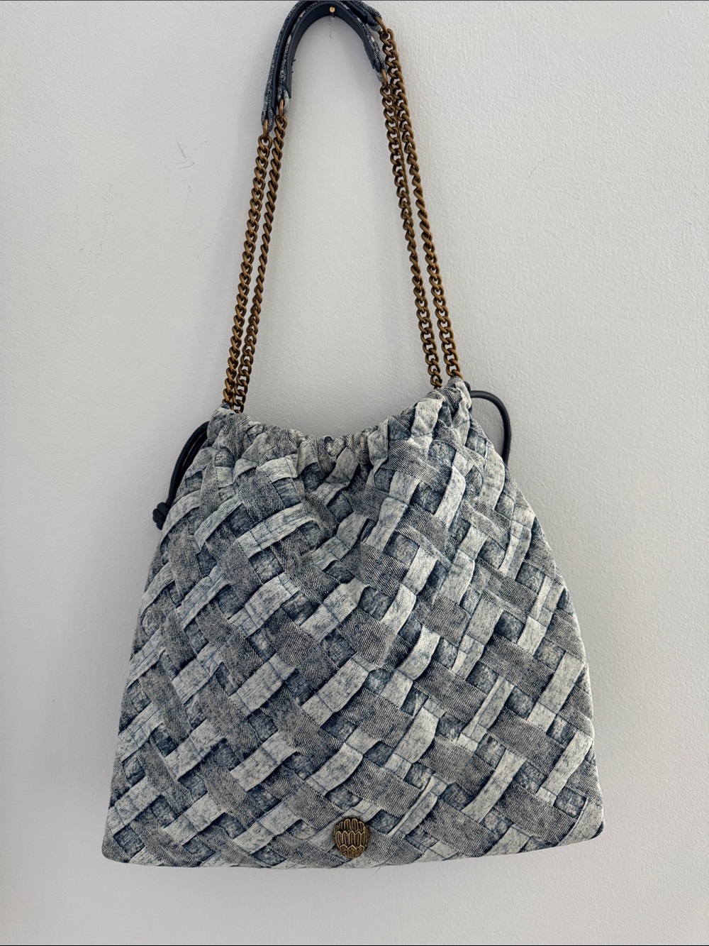 Denim woven shoulder tote by Kurt Geiger with brass chains
